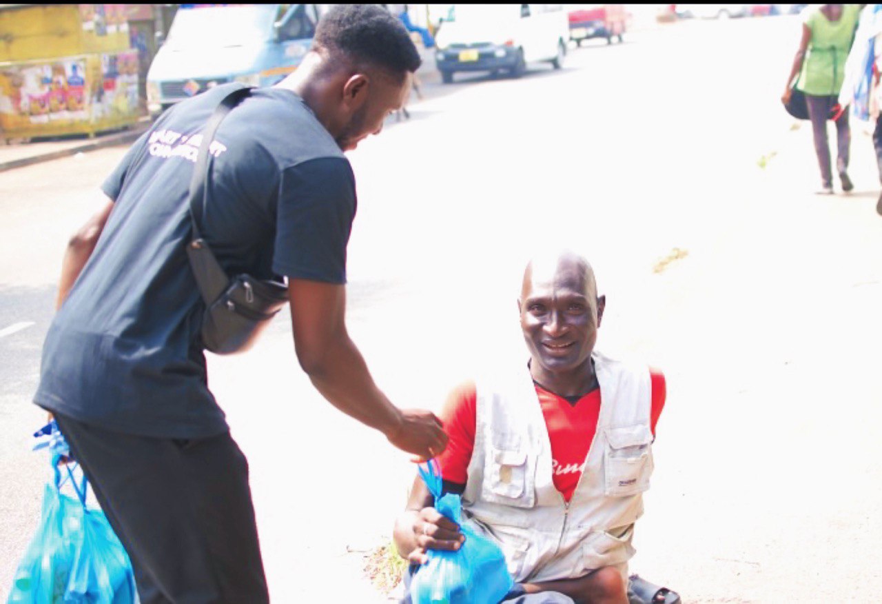Volunteer serving food during Dining with the Street outreach